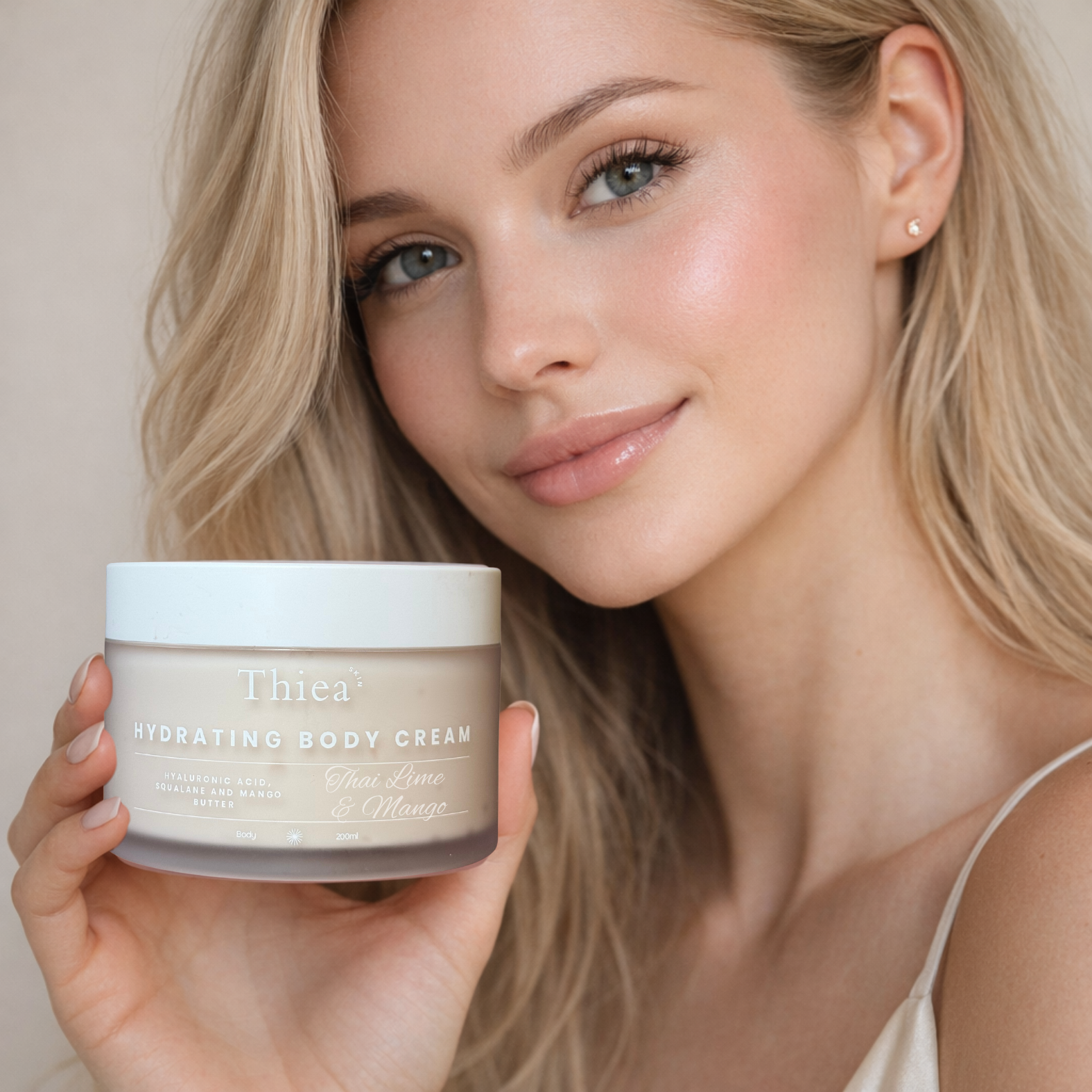 Woman holding a Thiea hydrating body cream jar with a neutral background