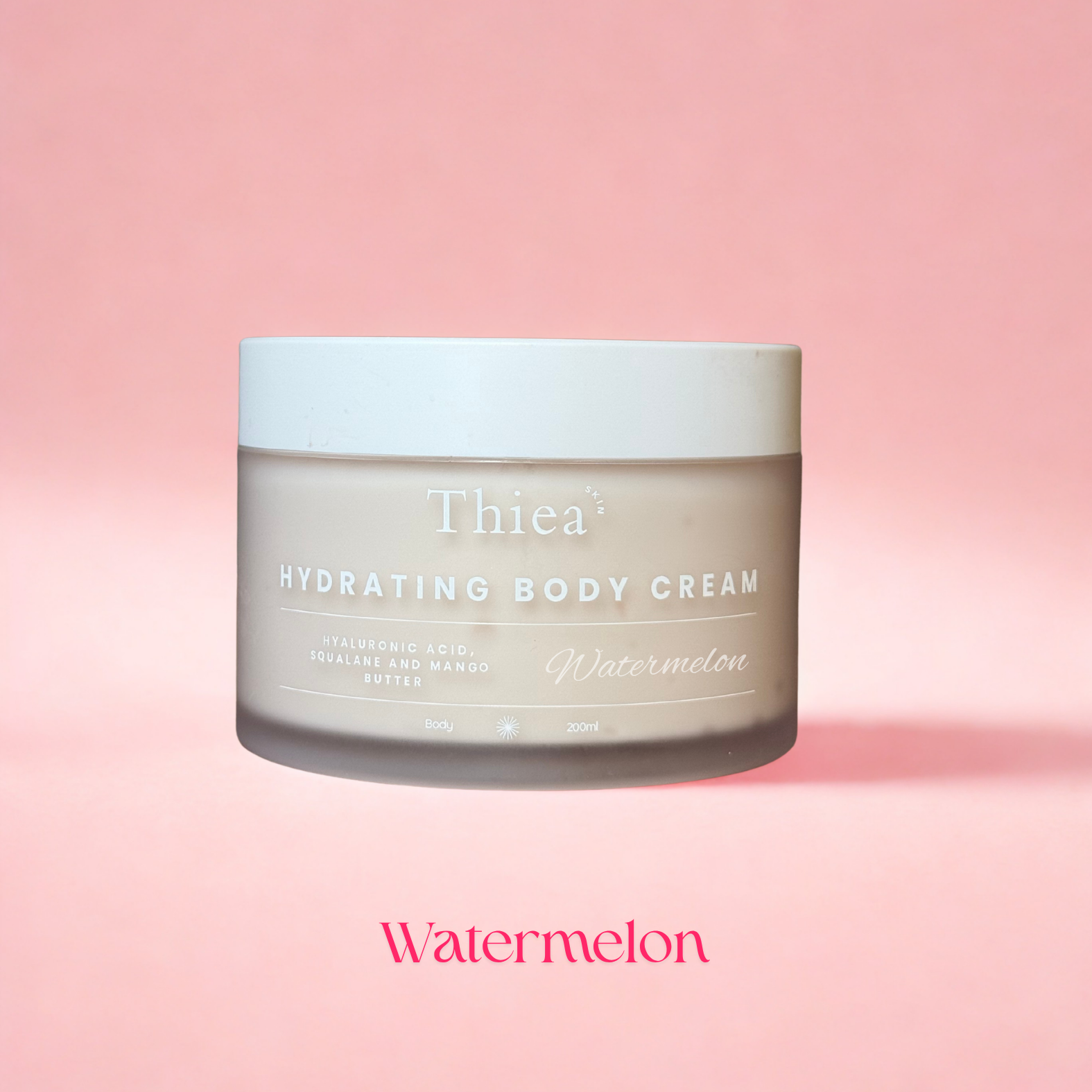 Thiea Hydrating Body Cream jar with 'Watermelon' flavor on a pink background